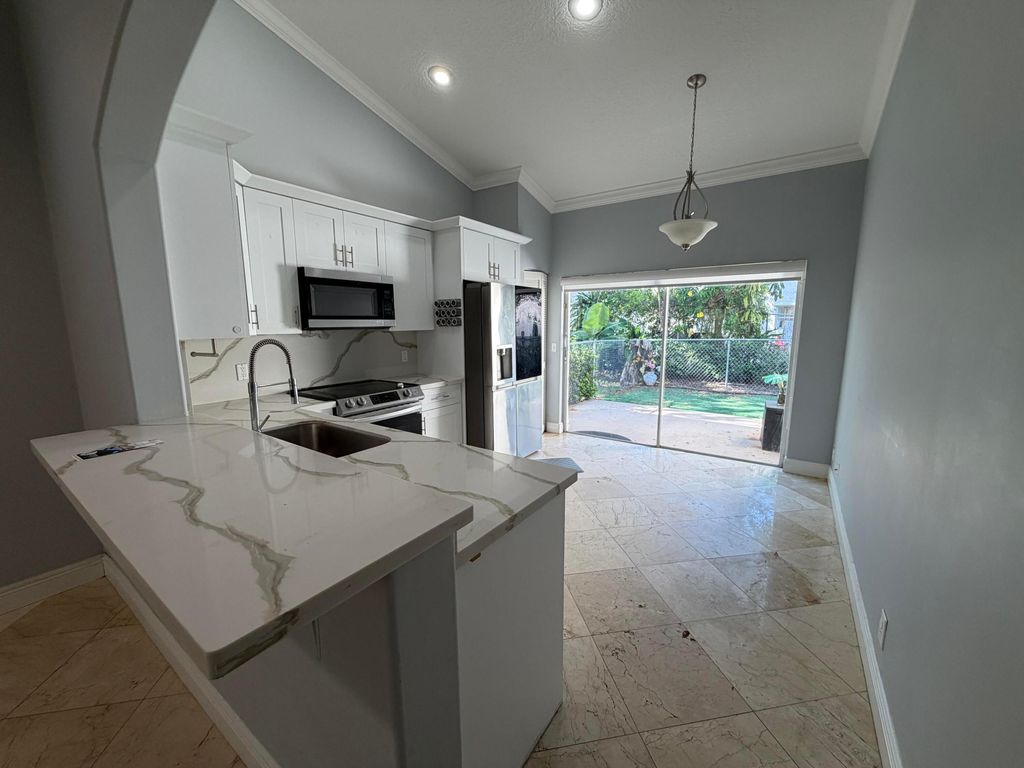 Photo of 7657 Sanctuary Drive, Coral Springs, FL 33065 (MLS # B26026960)
