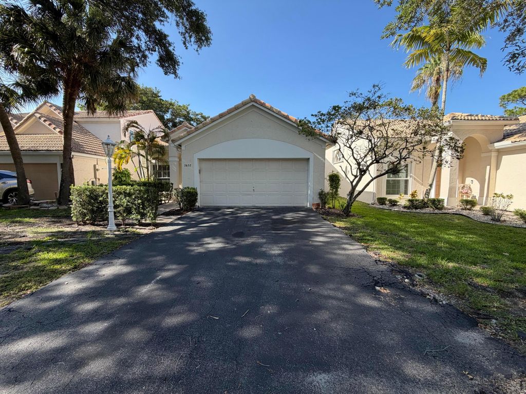 Photo of 7657 Sanctuary Drive, Coral Springs, FL 33065 (MLS # B26026960)