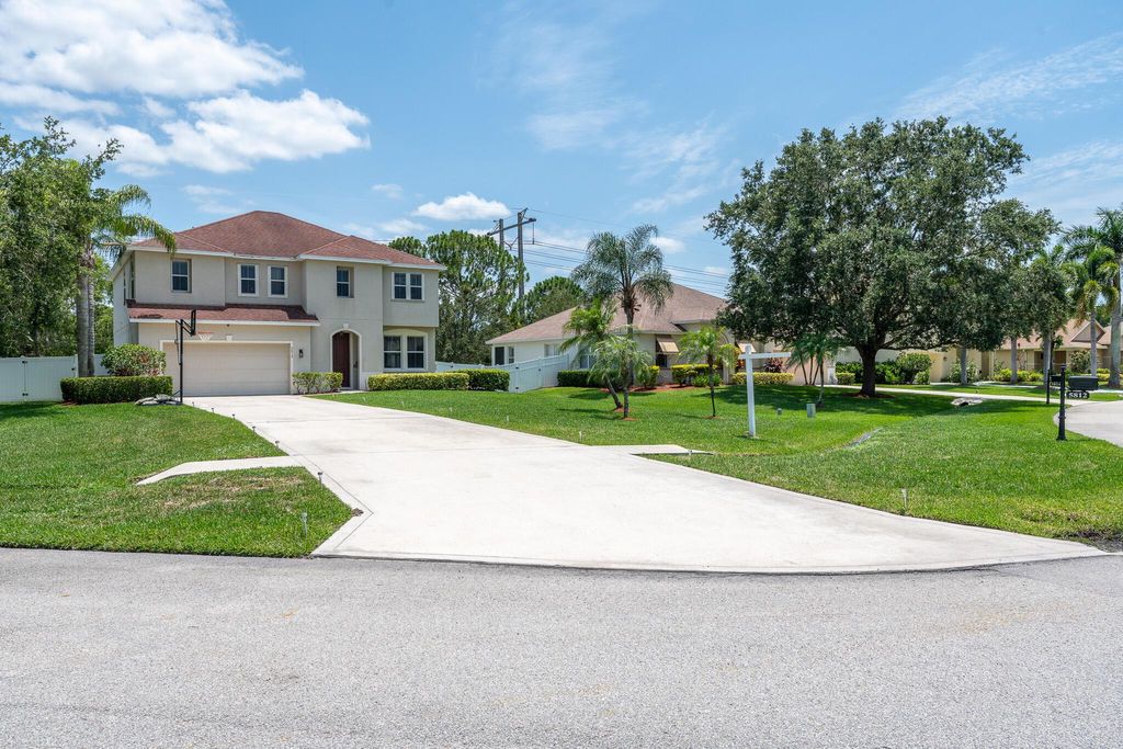 Photo of 5812 NW Windy Pines Lane, Port St Lucie, FL 34986 (MLS # R10894159)