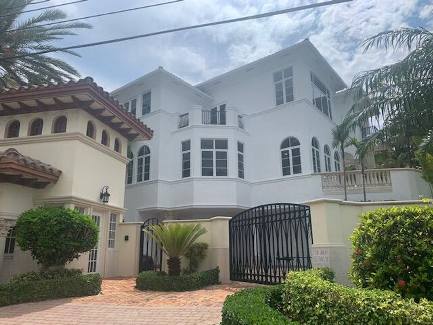 East on A1A in exclusive oceanfront gated enclave. Freshly painted in and out Large rooms & open living spaces make this home a perfect retreat for beach living for yourself or entertaining family & friends! Enjoy stunning intracoastal views, private pool & deeded wide beach access! Interior features a granite chef's kitchen with stainless steel, gas appliances, volume ceilings, saturnia flooring, impact windows, elevator, 4 bedrooms with en-suite baths, & separate his & her baths in master