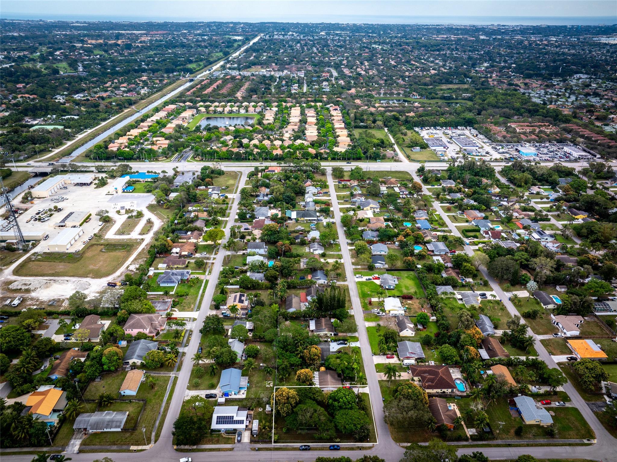 Fantastic location to build your custom home. This lot has been kept in the family since the 1960s. Just a quick drive (minutes) to downtown Delray, shoppes, restaurants, beach, and entertainment. Situated on a corner lot, fenced in, and in a quiet neighborhood with No HOA, this property is currently being beautifully maintained and has a few tropical plants and trees, such as mangos, poinciana, oaks, and others.