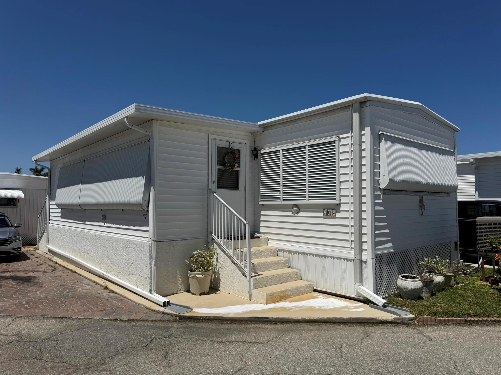 This is a nice price for a 27 share unit at Briny on the West side of A1A. 1 and 1/2 baths with laundry. Great unit sits high and dry. Come bring your touches to make this your Briny escape. Briny offers a prvate beach, intracoastal access, clubhouse, game roms, world class shuffleboard courts, indoor pickleball, art rooms, library, workshop. Many clubs and activities throughout the year.