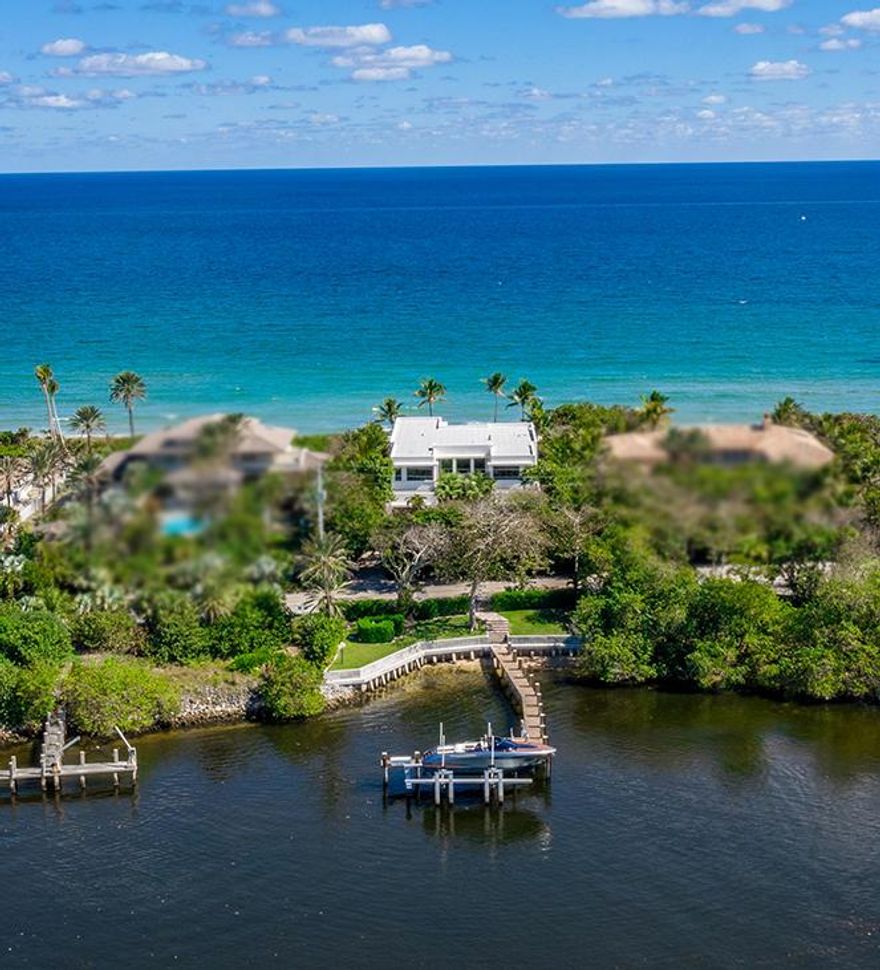 Perfect Seclusion, the beach meets ultra luxury modern everyday living!! TurnKey, bring your bathing suit and clothes,optional!!!  ''InstaLife Move in Ready''. 1 Acre +/- of DIRECT OCEAN beachfront to Intracoastal (Priv dock/lift for yacht/boat/toys) PRIV gated compound/estate has: Huge Master w/ 2 Master Baths (hair salon),2 massive custom closets,breakfast/evening bar, VIP Guest Rooms, Bespoke kitchen with the finest features to any chefs delight, that open to formal/casual dining and family room , custom wine area,(outdoor BBQ),custom clubroom/game room/bar, custom gym w/ latest equipment, multiple flex spaces, also for. 4+ car garage. Doors slide open to allow the inside to merge in harmony!! Literally too many details to list!! 12,562 SQ FT