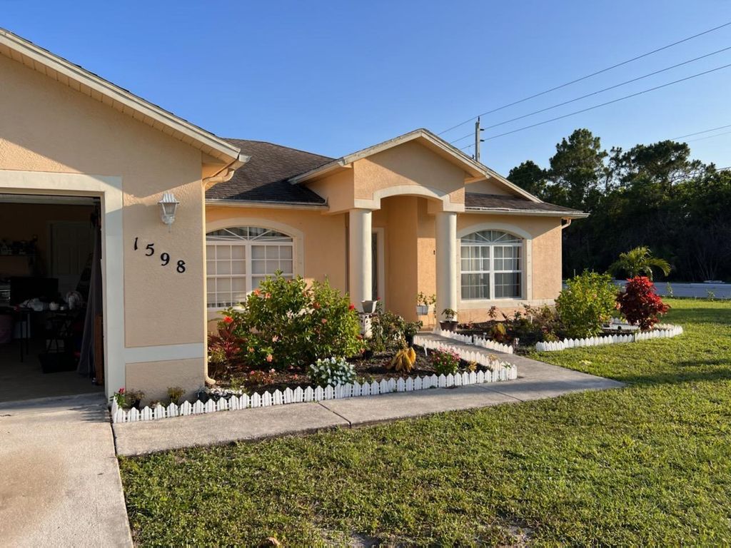 Photo of 1598 SW Bermel Avenue Ave, Port St Lucie, FL 34953 (MLS # R10803990)