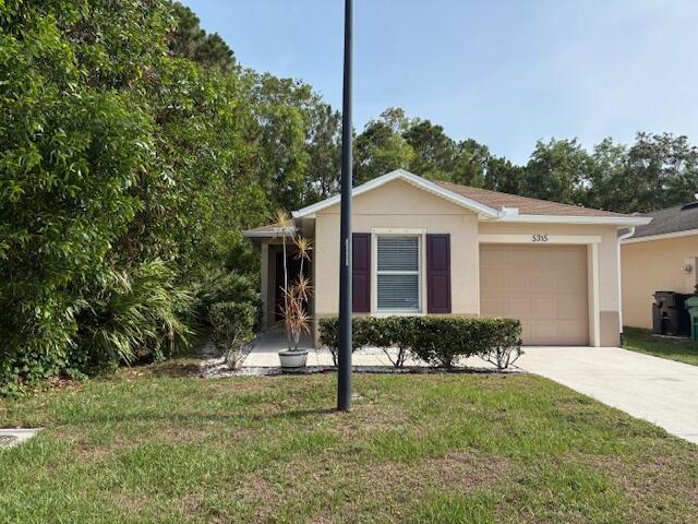 Buy this for what you probably pay in rent. Move right in to this lovely 2/2/1 updated Single Family home on a wooded lot in a great area. No neighbors on one side & just woods behind you. Open floor plan. Upgrades include wood look plank tile throughout, inside freshly painted, bathrooms upgraded. A/C & duct work all replaced in 2023. Also in 2023 new washer, dryer & refrigerator.Security cameras do not convey.Come make it yours.
