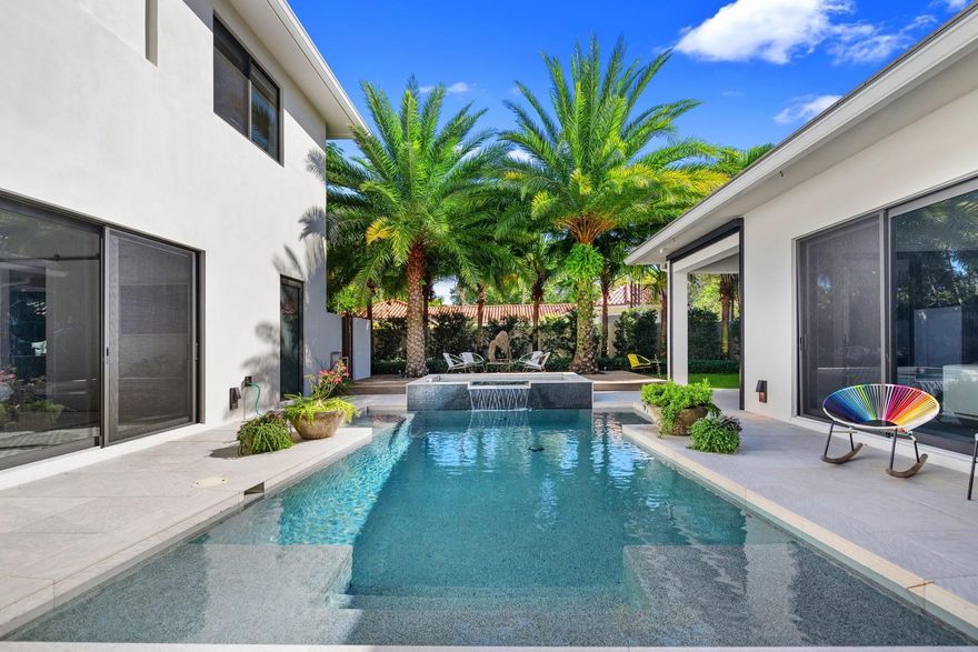 Completed in 2018 with warm modern touches and a Zen vibe, this is the perfect place to call home! The functionality of this 4 BR, 4.1 BA 4300+SF residence is made for real living with designer finishes, porcelain & hardwood floors throughout with vaulted ceilings. The gourmet kitchen has all the high-end appliances a chef could ask for along with a massive waterfall natural stone island with built-in breakfast table and separate wet/coffee bar. Primary suite with spa bath,walk-in closet and outdoor shower. All bedrooms en-suite with electric blackout shades. Serene outdoor living with lush landscaping,heated saltwater pool/spa, summer kitchen & al fresco dining with automated screens. Control 4Smart Home security,Generac Generator, 2 bay garage. Sought after Bayview School in Coral Ridge