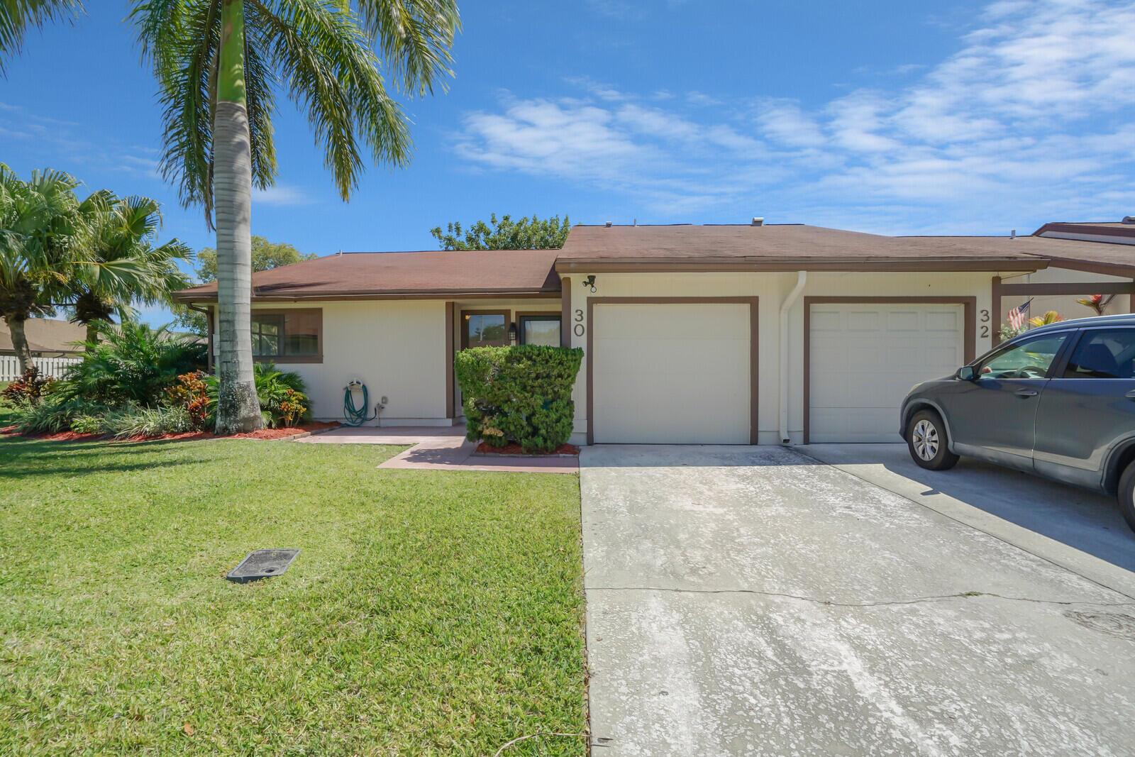 Beautifully maintained corner villa featuring 3 bd and 2 ba, along with an attached one-car garage. Enjoy the covered screened patio and paver patio that overlook a spacious grassy area. Situated in the sought-after Boynton Lakes community, this villa offers excellent amenities including a pool, tennis courts, and pickleball courts. Also includes a versatile 3rd bedroom, currently used as a den/office, and boasts a screened patio/sunroom with a garden view and no rear neighbors. The interior features laminate flooring and fresh paint. Boynton Lakes provides fantastic amenities such as a pool, a park with a playground, walking/jogging paths, and racquetball courts. Conveniently located near I-95, shopping, and dining options!