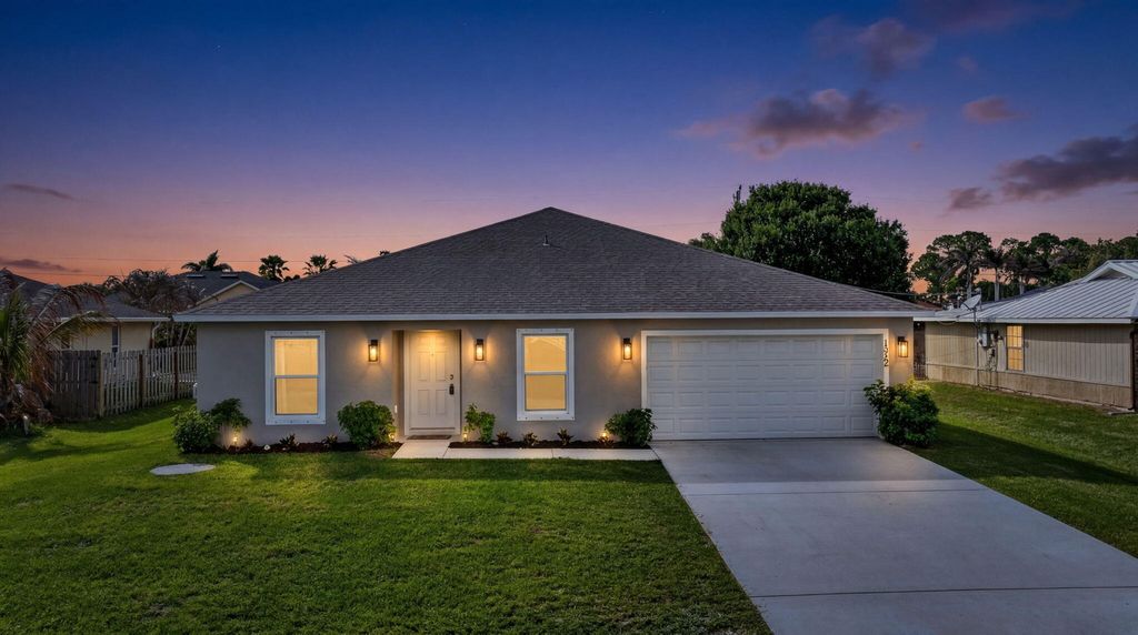 Photo of 1932 SW Lennox Street, Port Saint Lucie, FL 34953 (MLS # B26019904)