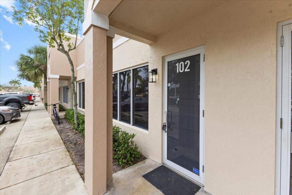 Photo of 9020 Bellhurst Way #102, West Palm Beach, FL 33411 (MLS # R11152887)