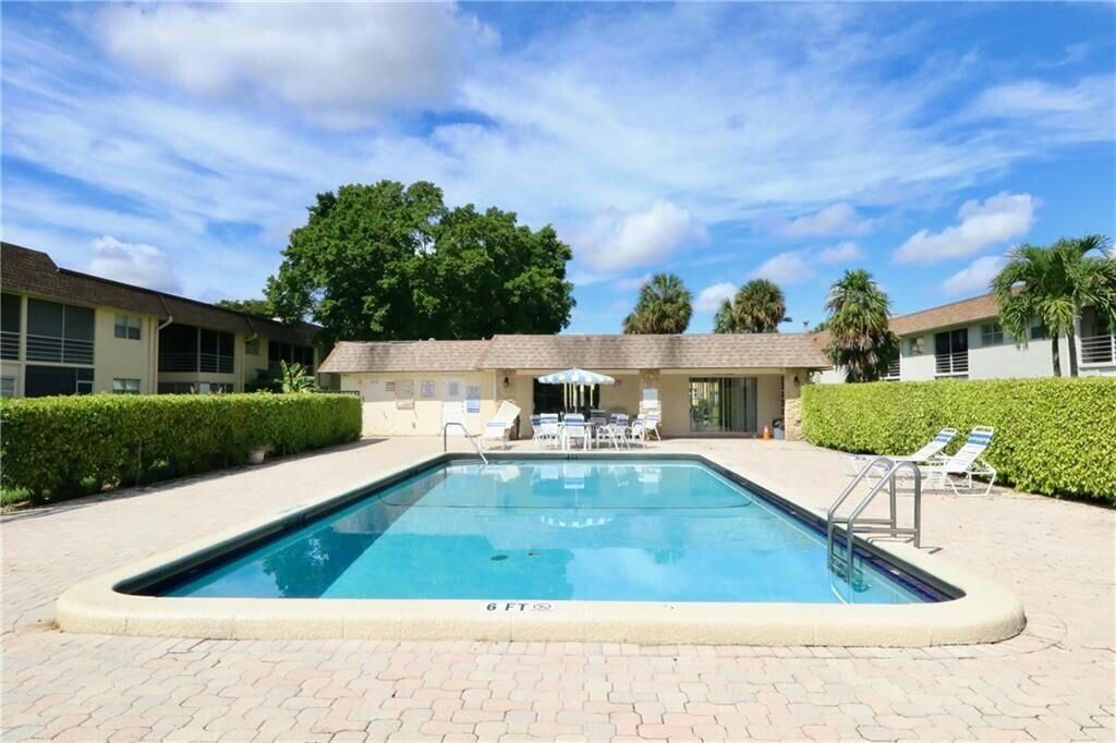 Photo of 9915 Sandalfoot Boulevard #408, Boca Raton, FL 33428 (MLS # B26019399)