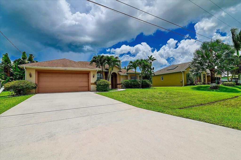 Photo of 4013 SW Winslow Street, Port Saint Lucie, FL 34953 (MLS # R11019474)