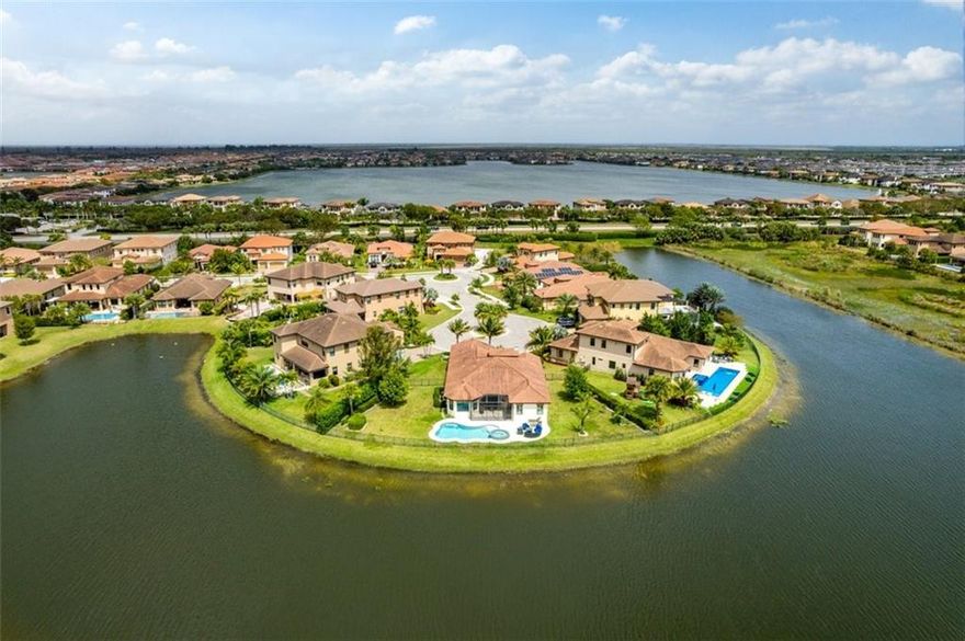 Simply a beautiful home with glorious panoramic waterviews throughout. Sited on a jaw-dropping waterfront point lot within a quiet culdesac. With an open layout & impeccable finishes, it is perfect for gracious & relaxed living/entertaining. Epicurean kitchen featuring a large island, soft white cabinetry, top-shelf appliances, quartz counters, gas stove & glass tile backsplash. The spacious primary suite is a private retreat with a sitting area, spa-like bath with a separate tub & shower. Enjoy luxurious South Florida living with breathtaking outdoor living areas with a screen porch, pool with champagne spa, expansive backyard, and serene water frontage. Other offerings: impact window/doors, plantation shutters, triple split design, temperature control pool & world-class amenities. Luxurious resort-style living awaits you in Heron Bay. Heron Bay has 3 guard gates, all manned 24 hours per day.  There are 2 clubhouses with unlimited access for homeowners: resort-style pool, 2 fitness centers with multiple classes, tennis courts for daytime or nighttime play, community events, basketball, pickleball, playground, bike/walking paths, and so much more.