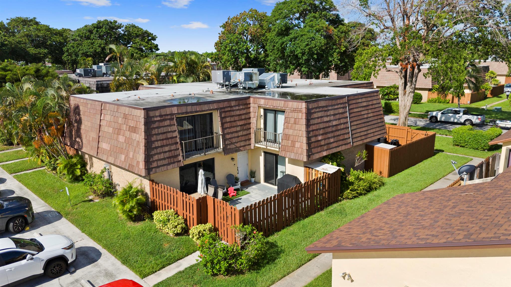 Beautifully maintained 2BR/2BA townhome in Springdale with all major updates done! Enjoy peace of mind with a new roof, impact windows & fence (2024), new flooring (2023), and AC (2020). Both bathrooms have been tastefully updated, while the kitchen remains original, offering the perfect opportunity to design your own style and add value. Spacious layout with natural light and a private fenced patio for relaxing or entertaining. Community features include a pool, tennis courts, pickleball, and green spaces with low HOA fees. Centrally located near shopping, dining, and schools, with quick access to major highways and only 4 miles from Lake Worth Beach. Move-in ready with endless potential!
