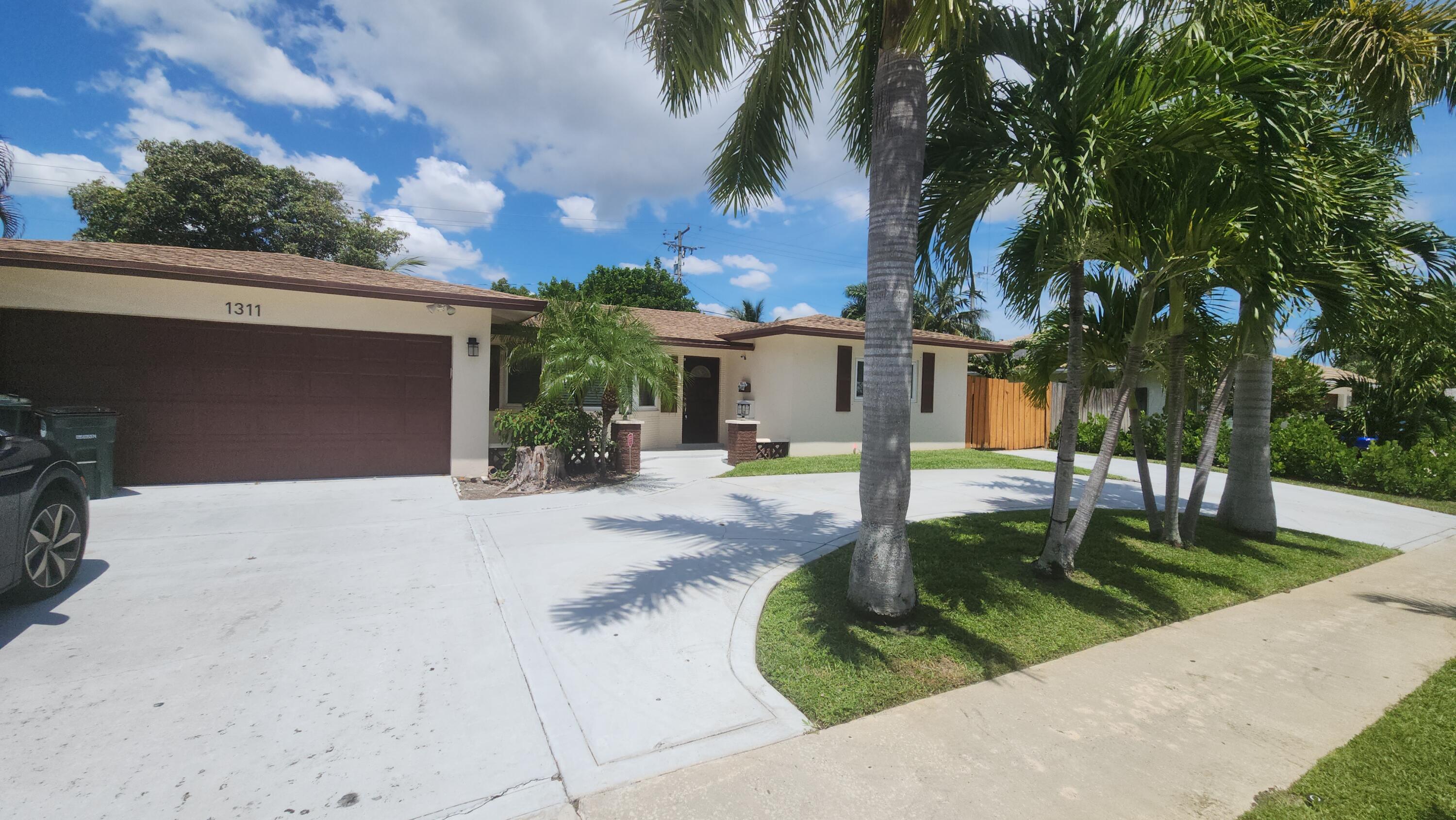 spacious updated 3 bedroom home in Boca Square. large fenced backyard, 2 car garage, split floor plan with a huge covered and screened patio. just a few blocks from Addison Mizner Elementary, minutes from downtown and beach, room for boat/RV, and a circular driveway capable of accommodating multiple vehicles. Updated bathrooms, tile throughout, wonderful home. rent includes Lawn maintenance.