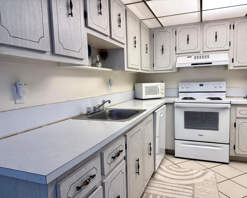 Photo of 1360 NW 19th Terrace #102, Delray Beach, FL 33445 (MLS # R11137371)
