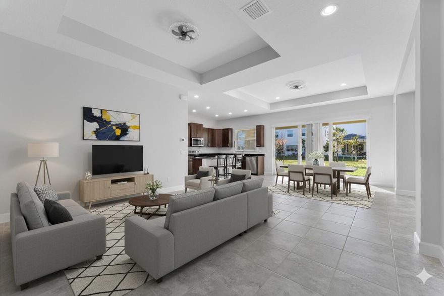 Discover this modern, move-in-ready home that seamlessly blends style and convenience. The open-concept kitchen boasts granite countertops, stainless steel appliances, and a spacious island ideal for gatherings. With high tray ceilings and elegant tile flooring, the main living areas extend to a covered lanai. The spacious primary suite features a charming bay window and a spa-inspired bathroom with a dual vanity and walk-in closet.  Located directly behind the school and close to the emergency room, daily errands are a breeze with Publix, Aldi, and a soon-to-open Walmart nearby. Plus, you're just steps away from a large park and the amazing community amenities.