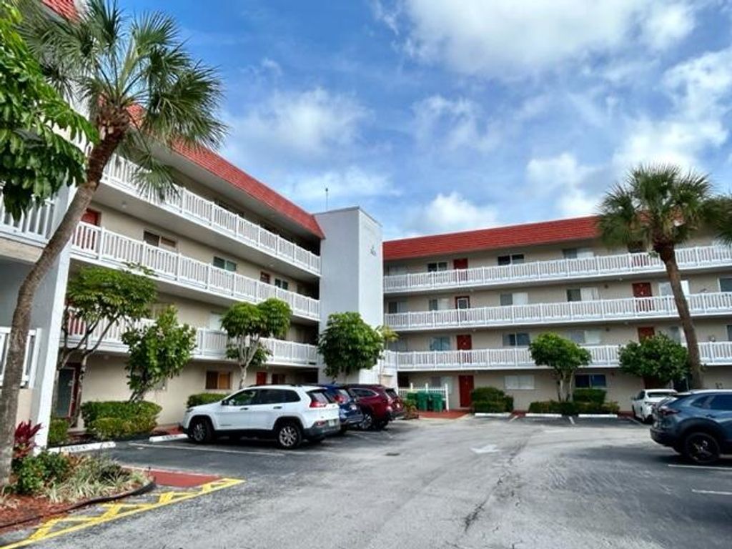 Photo of 3601 Inverrary Drive #306, Lauderhill, FL 33319 (MLS # B26025218)