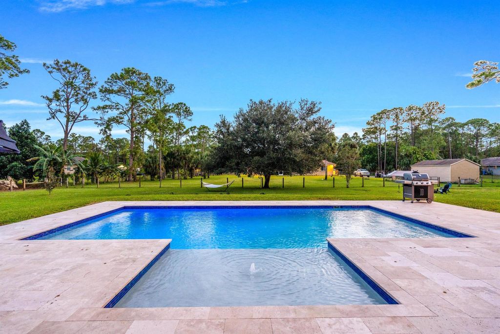 Photo of 15632 69 Court N, The Acreage, FL 33470 (MLS # R11099785)