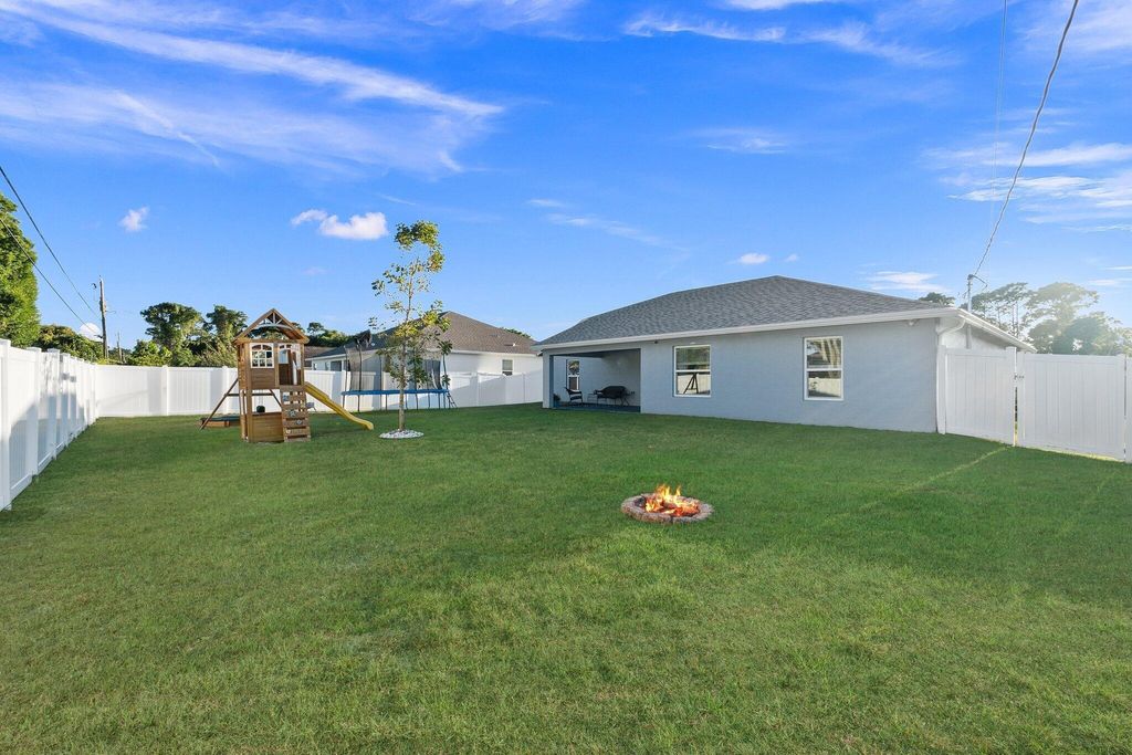 Photo of 1697 SW Day Street, Port Saint Lucie, FL 34953 (MLS # R10981650)
