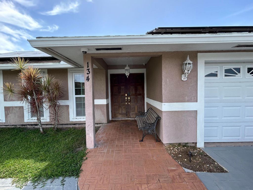 Photo of 134 Galiano Street, Royal Palm Beach, FL 33411 (MLS # B26053467)