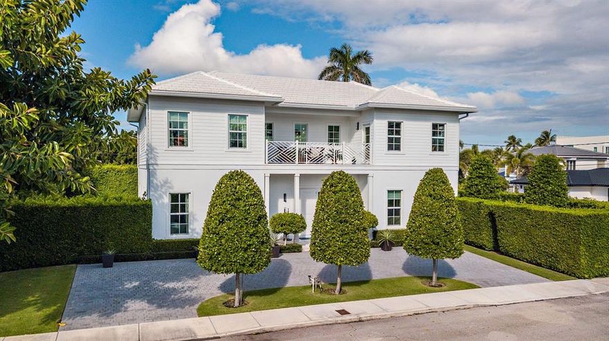 Superb, move-in ready British West Indies style residence offers 5 Bedrooms + Den/Library, 4 Full Baths and Two 1/2 Baths (4945 sf. +/- total). Highlights include an open floor plan, 10' high ceilings, 7'' wide White Oak hardwood floors, a gourmet kitchen with Carrara marble counter tops, Thermador appliances and Grohe fixtures. This home is situated on a large 107' x 110' corner lot and has intracoastal water views from the second floor. Outside features include a covered loggia, heated swimming pool and a great side yard with plenty of space to enjoy the outdoors. Immaculate two car garage.