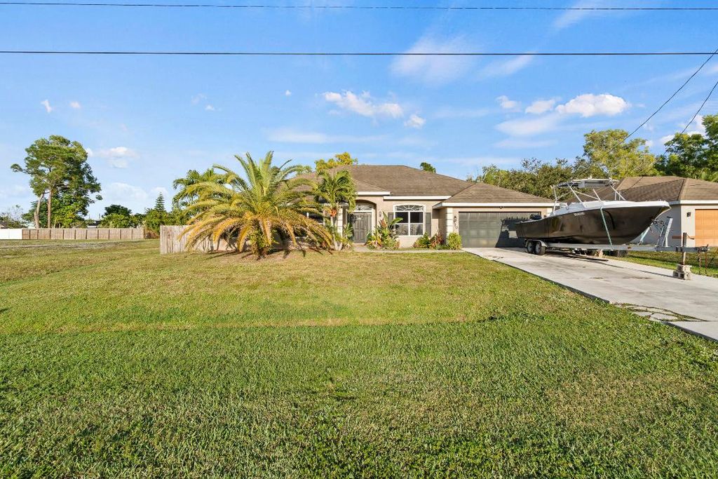 Photo of 370 SW Tulip Boulevard, Port Saint Lucie, FL 34953 (MLS # R11147511)