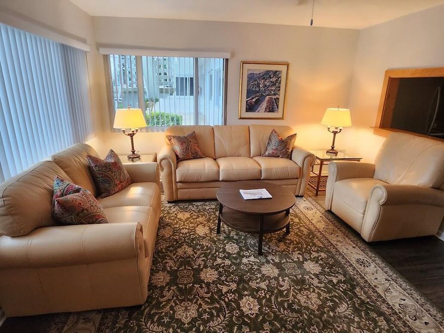 ''Refreshed'', sophisticated, 1 BR unit in well maintained/financially stable 55+ complex. Truly must visit in person! FIRST floor. lmpact glass. Newer AC/water htr. Located 8 min from ocean/across from 750-acre John Prince Park. Walking/biking trails nearby. Lake views from 2 LR windows. Assigned parking space/guest spot in front of unit. Gorgeous bamboo flooring. Furniture negotiable. Custom all wood kitchen. Great natural light! Tranquil bedroom w/private backyard. 2 min to 95 freeway/Tri-rail station. 5 min to dwntwn Lake Worth Beach. 15 min to WPB/Delray Beach for their abundant restaurants/shopping. Amenities: gigantic pool, 2 gyms, pickleball, bocce ball, shuffleboard, BBQ area, library, auditorium shows movies. Internet included! 700 credit score. No pets. This building has reserv