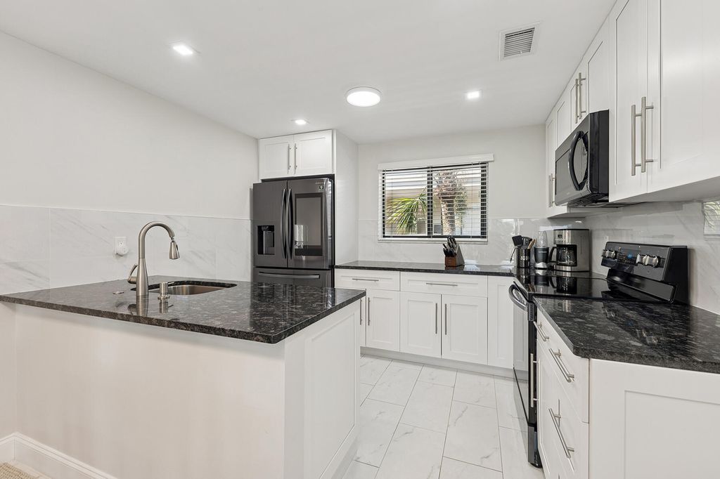 Photo of 5340 Las Verdes Circle #322, Delray Beach, FL 33484 (MLS # R11134527)