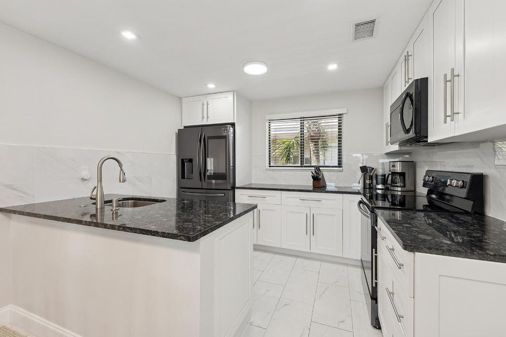 Photo of 5340 Las Verdes Circle #322, Delray Beach, FL 33484 (MLS # R11134527)