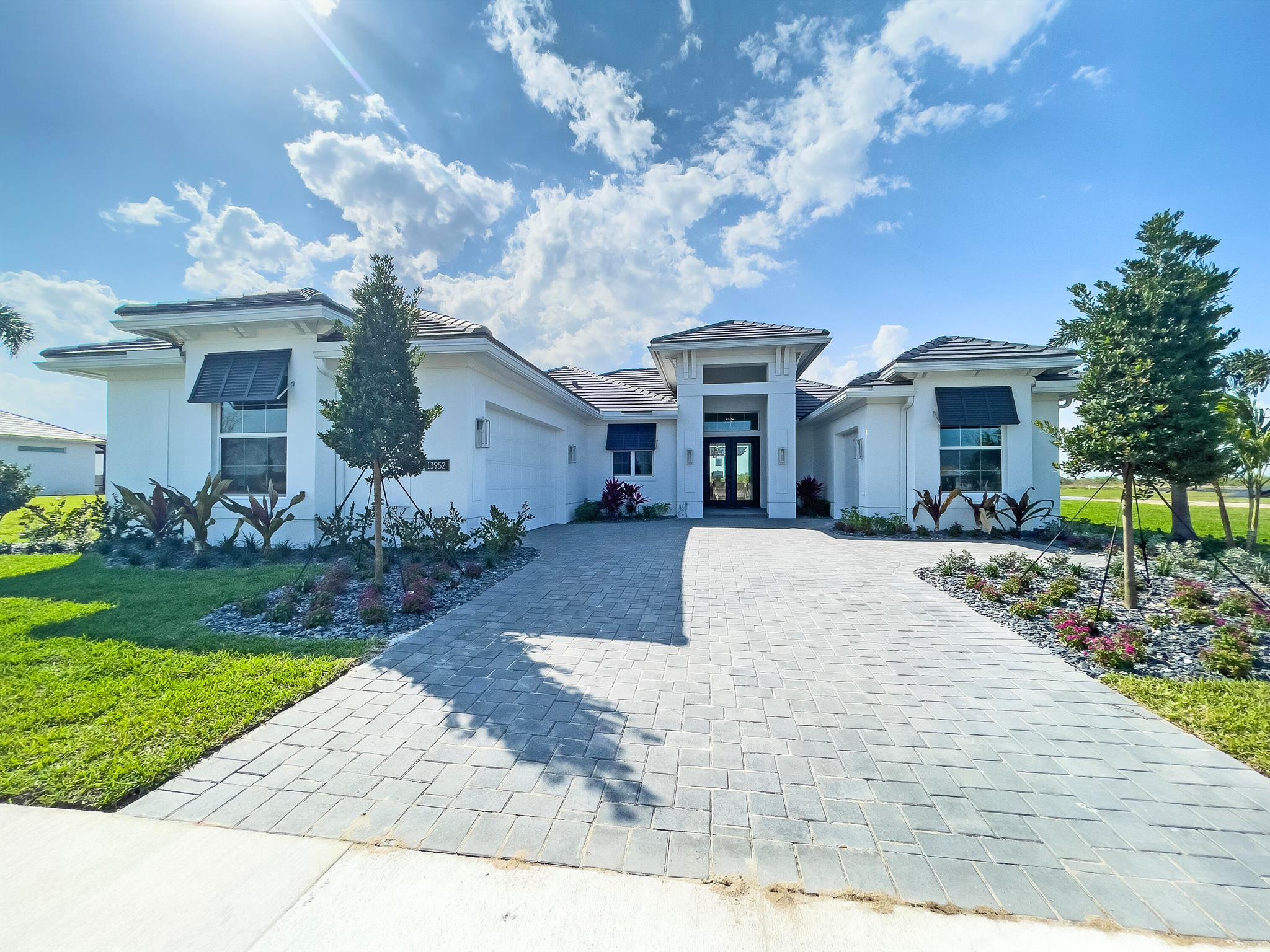 Fullly Decorated Model! Large Lake View, Large Pool, Sunshelf with Bubbler, 2 raised waterfalls and a SPA! BELTERRA is the newest luxury boutique-community to emerge inside of the highly sought after Tradition. All ages, single family and gated. BELTERRA has resort lifestyle amenities including a clubhouse with tennis, pickleball and basketball courts, wine lockers, a billiards and card room, resort-style swimming pool and a state-of-the-art fitness center. Additional upgrades made to the home: Coastal elevation, Aspen free-standing tub master bath upgrade, workshop garage upgrade, Bonus room upgrade, stacked cabinets in the kitchen.