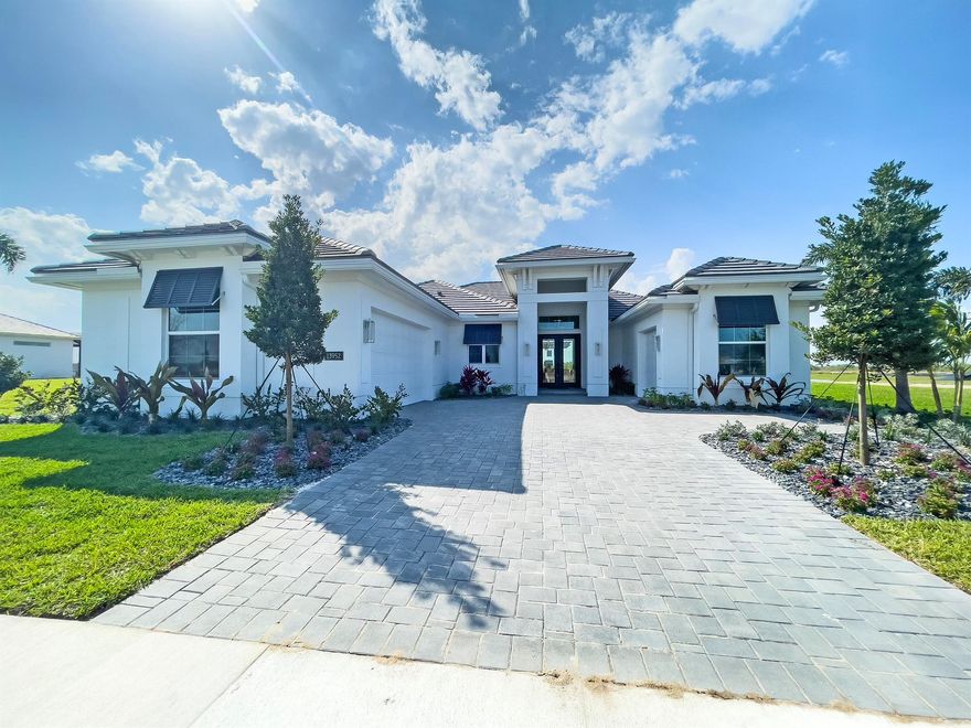 This Sage model home is now available for purchase as a fully furnished and professionally decorated showcase residence. Offering 2,790 square feet of air-conditioned living space and a total of 3,776 square feet, this thoughtfully designed home features 3 bedrooms, 2.5 bathrooms, bonus room and a 2-car garage with a workshop upgrade. Every inch of this home has been curated with upscale finishes and designer touches, including a coastal elevation, a luxurious Aspen free-standing tub in the master bath, and a versatile bonus room. The gourmet kitchen boasts stacked cabinetry with under-cabinet lighting, while the club room includes a stylish bar area with a beverage center.