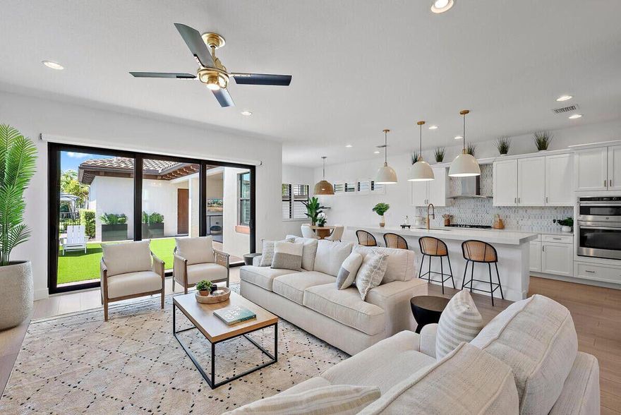 Experience unparalleled luxury in this NEWLY RENOVATED, FULLY-FURNISHED, turnkey home located in the desirable Alton neighborhood. This modern home features 5 bedrooms, 2.5 bathrooms, the versatile, updated 5th bedroom can also serve as an office space. Step inside to discover new everything - luxury vinyl plank flooring that extends throughout the home, fresh paint, hardware, mirrors, contemporary lighting fixtures, and a striking new front door which floods the house with natural light. The home is adorned with plantation shutters throughout as well as motorized shades in the living room for privacy. Enjoy the outdoor oasis which has been meticulously updated for lounging, entertaining, or playing. Situated within walking distance to the Alton Clubhouse boasting a resort-style pool, fitness center, along with tennis, pickleball, basketball, and volleyball courts, this location is perfect for active families. Enjoy the convenience of nearby playgrounds and green spaces for kids to explore. The home's proximity to Alton Town Center offers a variety of shopping and dining options, while the beach is a three-mile drive away.