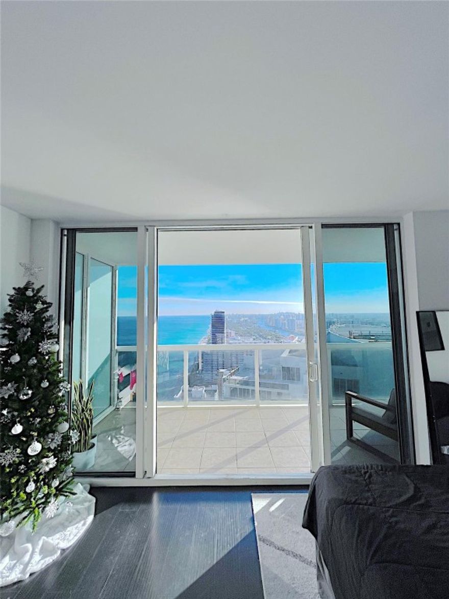 Available February 2026!  Live above it all in this stunning 49th-floor lower penthouse at the prestigious Beach Club in Hallandale Beach. This 1-bedroom, 1-bath residence offers breathtaking panoramic ocean, Intracoastal, and city views through floor-to-ceiling glass. Open-concept layout with modern kitchen featuring granite countertops and stainless steel appliances, rich dark flooring, and a private balcony perfect for sunrise and sunset views. Resort-style amenities include beach service, multiple pools, fitness center, spa, concierge, valet, and 24-hour security. A wellness enthusiast  DREAM! Spa is resort class with Cold Plunge, sauna, steam room, massages and a juice bar! Rent includes Parking Spot in covered garage close to tower 2 entry and complimentary Valet for 2nd Vehicle.
