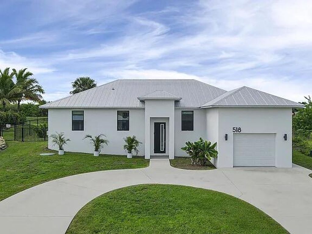 Photo of 518 SW Aster Road, Port Saint Lucie, FL 34953 (MLS # R10862108)