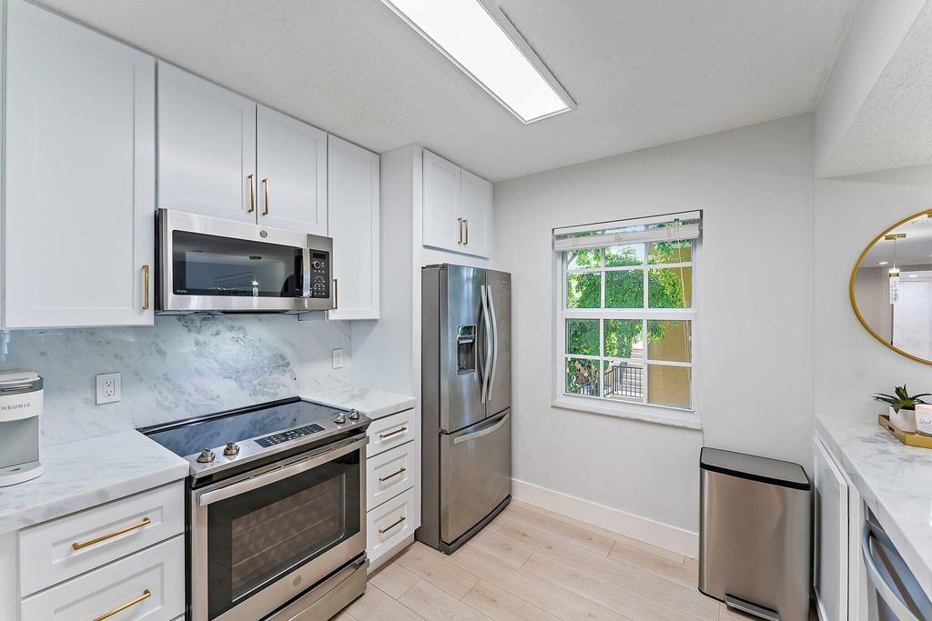 Photo of 1145 Lake Shore Drive #204, Lake Park, FL 33403 (MLS # R10936108)