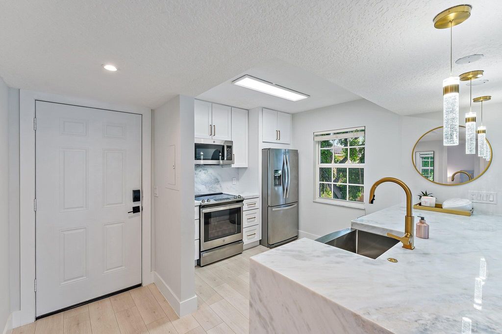 Photo of 1145 Lake Shore Drive #204, Lake Park, FL 33403 (MLS # R10936108)