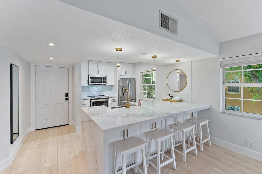 Located in Bay Reach Condos in Lake Park, this exquisitely updated 2-bedroom, 2-bathroom condo embodies luxury living. The recent renovations span from floor to ceiling, showcasing a modern and comfortable living space with an upgraded kitchen and bathrooms, all adorned with high-end finishes. This gated community provides not only security but also an array of resort-style amenities, with the highlight being the stunning pool overlooking the intercoastal, complete with a private beach area. As an added bonus, residents have access to a fitness center and clubhouse, and the possibility to lease a boat slip within the community. This property has everything you need to live life to the fullest in South Florida!