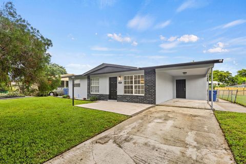 Photo of 1651 W 35th Street, Riviera Beach, FL 33404 (MLS # R11125519)
