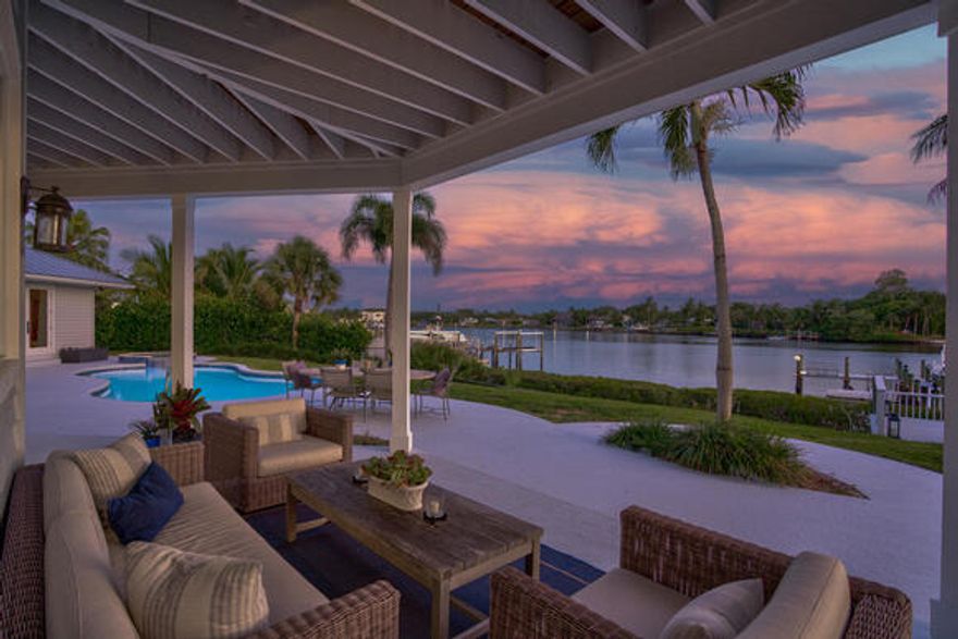 SPRAWLING PROPERTY ON THE HIGHLY SOUGHT-AFTER LOXAHATCHEE RIVER.  THIS 4400 SF GATED OASIS IS LOCATED ON NEARLY AN ACRE PARCEL.  THE 4BR/3.5 BA HOME IS EQUIPPED WITH ALL OF THE MODERN CONVENIENCES. WITH A CHEF'S KITCHEN PERFECT FOR BOTH COOKING AND ENTERTAINING,IT INCLUDES A SUB ZERO REFRIGERATOR AND WOLF APPLIANCES THROUGHOUT, A CUSTOMIZED BUILT-IN WET BAR, QUARTZ COUNTERTOPS AND A LARGE COUNTER-HEIGHT ISLAND TO EASILY PREP AND SERVE  MEALS WITHOUT MISSING OUT ON THE FUN.THIS HOME HAS AN INVITING FLOOR PLAN WITH 20FT VAULTED CEILINGS AND EXPANSIVE ENTERTAINING SPACES EACH WITH VIEWS OF THE RIVER. EXTERIOR FEATURES INCLUDE A UNIQUELY DEEP LOT PERFECT FOR A GUEST HOUSE/OFFICE, LUSH LANDSCAPING, PUTTING GREEN W/BUNKER AND DOCKSIDE FIRE TABLE,THE 2-CAR GARAGE COMES WITH TESLA CHARGER.