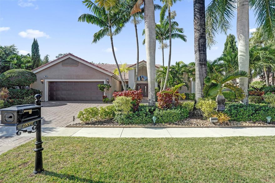 Welcome to 2891 NW 28th Terrace! Situated in the picturesque, highly sought after community of Boca Raton’s New Floresta, this spectacular updated residence features a triple split floor plan comprised of 4 Beds + 3 Full Baths. The open concept living, kitchen + formal dining areas feature exceptionally high ceilings + unobstructed views of the private (outdoor) heated pool travertine lounge area. The spacious family room is exceptionally private and features a fireplace.  The oversized primary suite features high cathedral ceilings + unobstructed views + access to the outdoor pool lounge + a recently updated primary ensuite bath.  Bathrooms two + three are newly updated.  Additional features include: Impact windows throughout, newer AC units + spacious circular driveway. Lets Take A Look!