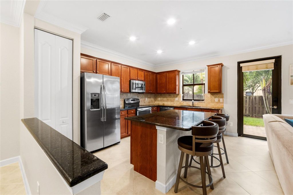 Photo of 9627 Town Parc Cir S, Parkland, FL 33076 (MLS # F10538951)