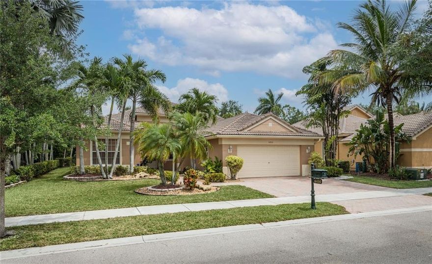 Gated community of Parkland Isles.  Enjoy the location, amenities, schools, parks, and everything the area has to offer.  This 4 bedroom 3 full baths pool and raised spa home has a newer kitchen and a great floor plan. Situated down a quiet street. Real nice curb appeal with brick pavered driveway and entryway along with the barrel tile roof and palm trees. Kitchen fully remodeled recently with center island, white cabinetry and elegant countertop.  Stainless steel appliances.  Neutral tile through main living areas. Master is spacious and offers views of pool. Light and bright. The backyard is fully fenced. This community with 24 hr manned guard gate, heated community pool & spa, gym, tennis, clubhouse, and much more. Low maintenance of $289 month alarm monitoring, cable and internet.