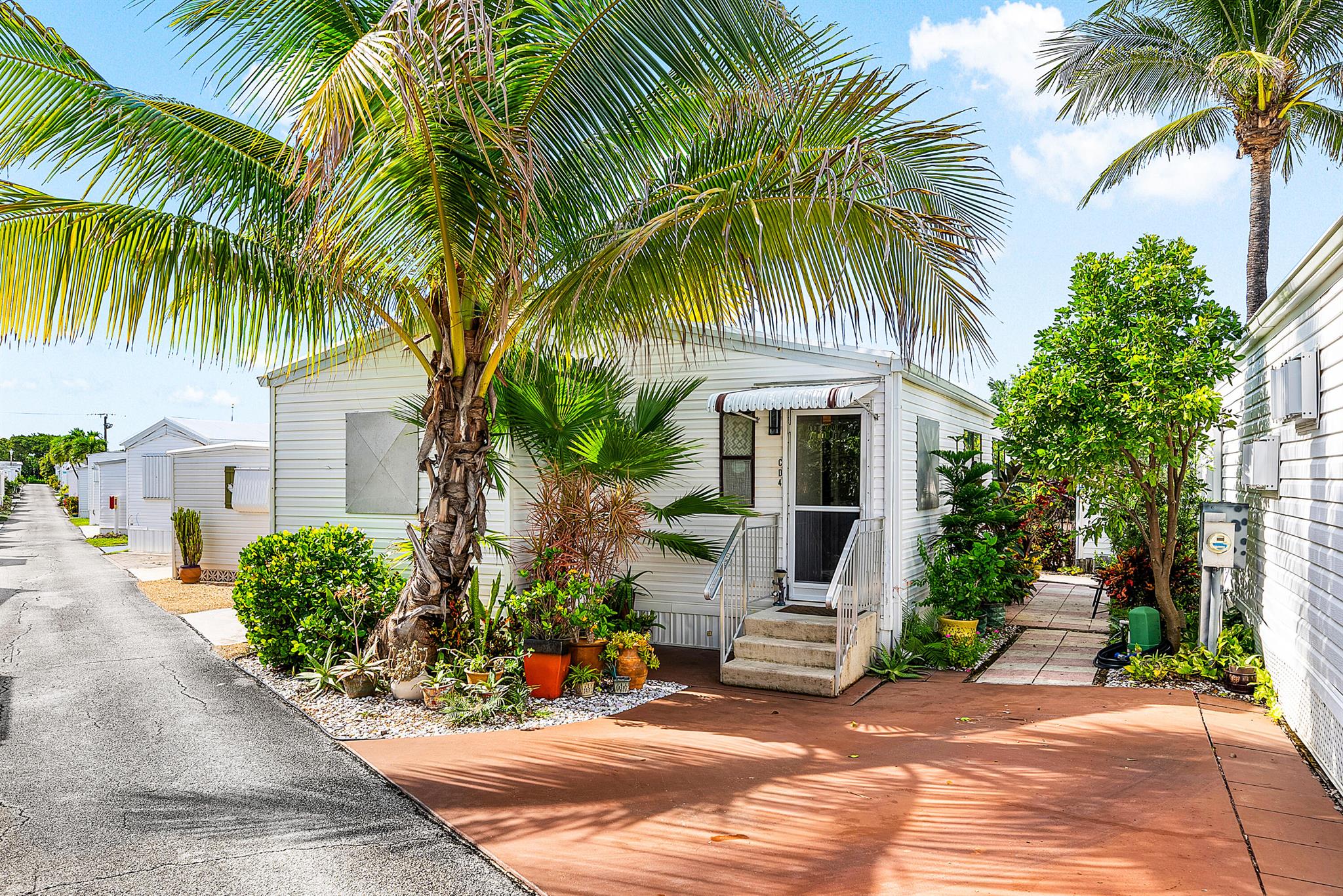 39 SHARES. Just four units from the sand, this fully furnished double-wide offers the perfect coastal retreat in the heart of Briny Breezes. With a spacious and open layout, this 1-bedroom, 1.5-bath home provides ample room for both relaxing and entertaining. The large living areas flow seamlessly, giving you the feel of a much larger space, while the bedroom suite offers privacy and comfort. Driveway directly outside unit. Enjoy the ease of a move-in-ready home complete with tasteful furnishings, abundant natural light, and the rare convenience of extra square footage. Whether you're looking for a seasonal getaway or a full-time residence, this beachside gem combines charm, comfort, and location--all just steps from the ocean.