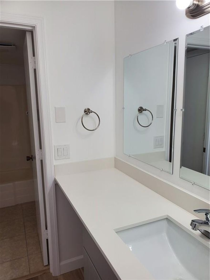 Stunning completely remodeled 1 bedroom one and a half baths.  corner unit located n a very quiet and very well maintained community, condo features new kitchen cabinets, new vanities in bathrooms, newly painted, 3 new ceiling fans. laminated floating floor throughout. property has a very easy access to all major highways, walking distance to shopping centers and all mode of transportation, on and half miles  East of I-95, 2 miles from the beach.