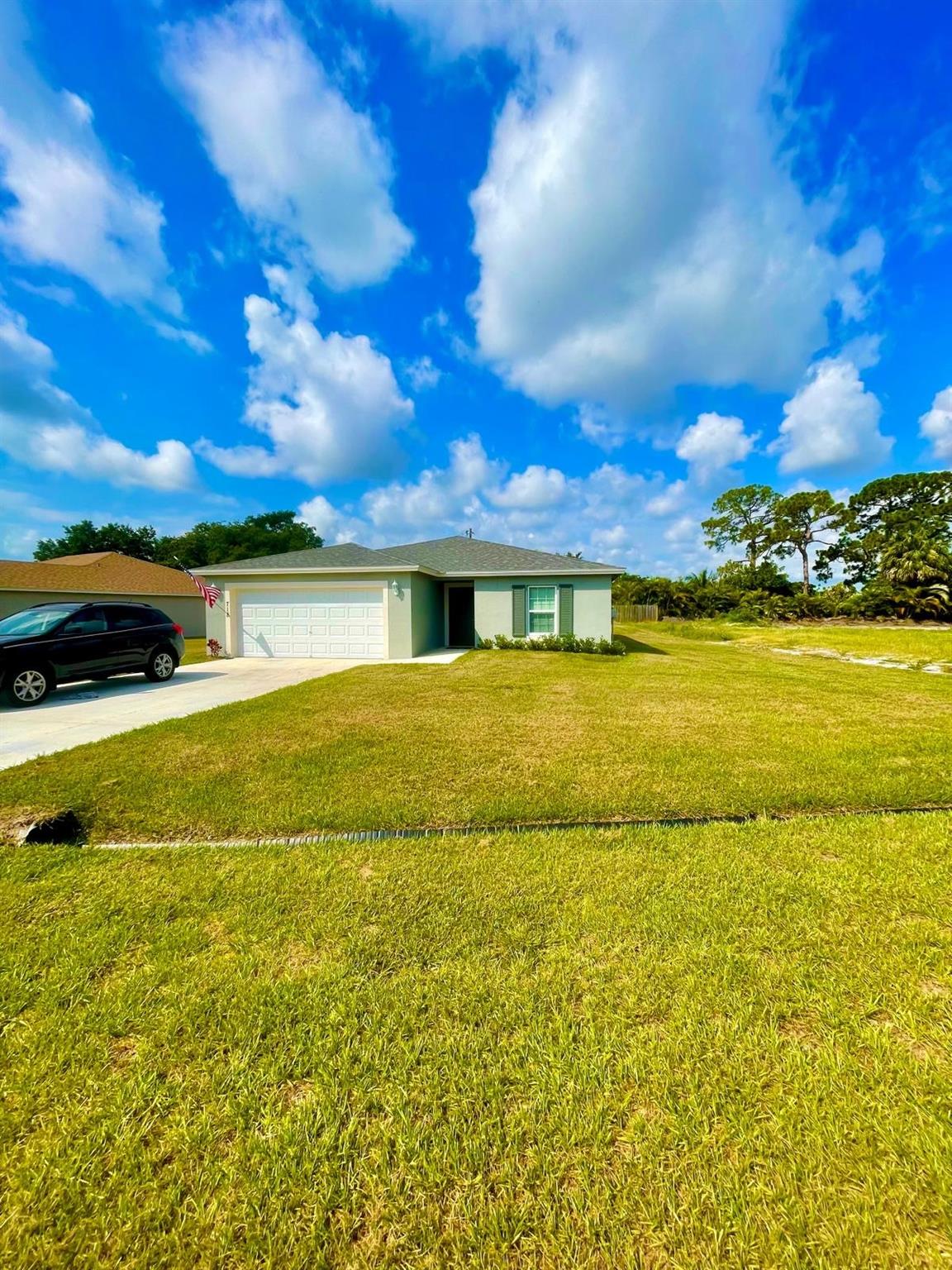 Charming 4-bed, 2-bath home with a 2-car garage on a spacious pie-shaped lot. Features a long driveway and large backyard. Prime location, minutes from waterfront, dining, mall, and shopping, and just 15 minute drive to the beach. Nearby parks offer soccer, playgrounds, BBQ, basketball, trails, disc golf, horseback riding, nature trails, hiking and so much more. U.S. News & World Report’s rank Port Saint Lucie as one of the Best Places to Live in the U.S for 2024-2025.
