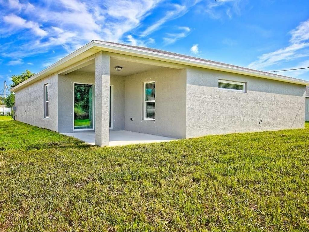 Photo of 718 NE Perch Lane, Port Saint Lucie, FL 34983 (MLS # F10517477)