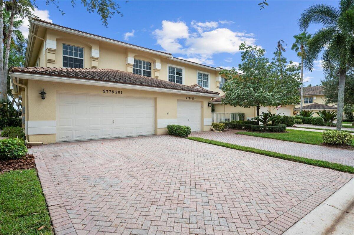 WELCOME TO THIS PRISTINE CORNER COACH HOME WITH STUNNING TREE TOP & WATER VIEWS, EASTERLY EXPOSURE TO ENJOY THE BALMY FLA BREEZES. SPACIOUS 2300 SQ FT OF LIVING SPACE IS VALUE PRICED. WITH AN OPEN FLOOR PLAN BOASTING TONS OF ENTERTAINING SPACE & NUMEROUS HIGH END FINISHES THRUOUT: NEUTRAL DIAGONAL TILED LIVING AREA & BEAUTIFUL CROWN MOLDING, GOURMET KITCHEN WITH 42' RAISED PANEL CABINETS, ROLL OUTS, GRANITE COUNTER TOPS, IMPACT WINDOWS & DOORS, PRIVATE ELEVATOR , FULL 2 CAR GARAGE & MANY UPGRADED & NEWER FEATURE: AC 2021, 2024 TOP OF THE LINE SAMSUNG REFRIGERATOR, & STOVE, DRYER, NEST THERMOSTAT, BEDROOM CARPETING, GARAGE DOOR MOTOR AND SPRINGS, NEW ADA HEIGHT COMMODES IN BOTH BATHS...THIS VERY WELL MAINTAINED HOME IS MOVE IN READY.