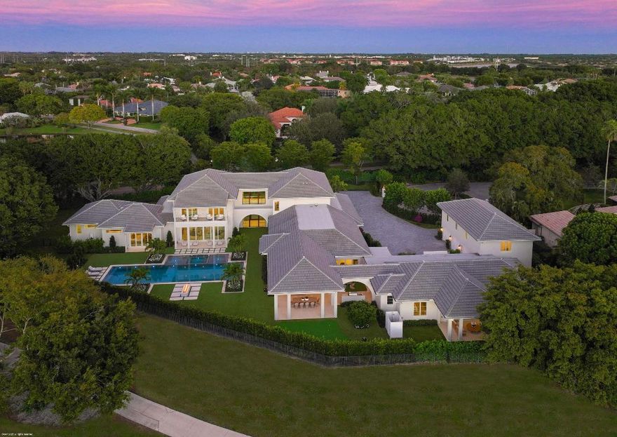 A newly constructed estate of rare distinction, this exceptional compound is set on over one acre in the heart of Palm Beach Polo. Designed for grand-scale entertaining and everyday luxury, the main residence offers five generously appointed bedrooms along with a club room, family/game room, dedicated exercise room, and a private spa complete with sauna and steam room. At the heart of the home, an incredible open-concept kitchen flows seamlessly into the great room and dining area, all overlooking the resort-style pool and expansive covered loggia creating a perfect indoor-outdoor lifestyle. Complementing the main residence is a separate two-bedroom guest house, ideal for hosting. An additional one-bedroom apartment above the garage offers another layer of privacy and flexibility. The outdoor amenities rival those of a private resort, including a swimming pool with spa and sun decks, fire pit, putting green and a fully equipped outdoor kitchen. A 5.5-car garage completes this extraordinary offering. Truly the ultimate estate compound, this one-of-a-kind property delivers unparalleled luxury, space and privacy within Palm Beach Polo.