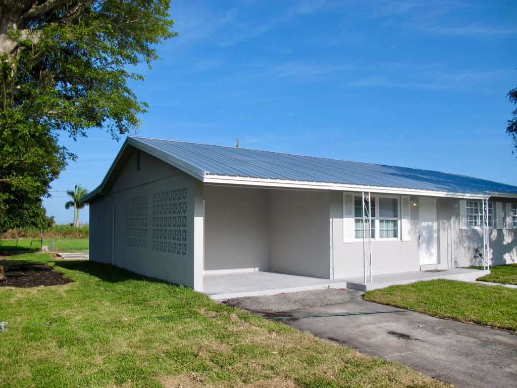Photo of 156 N Greenstar Avenue, Pahokee, FL 33476 (MLS # R10976316)