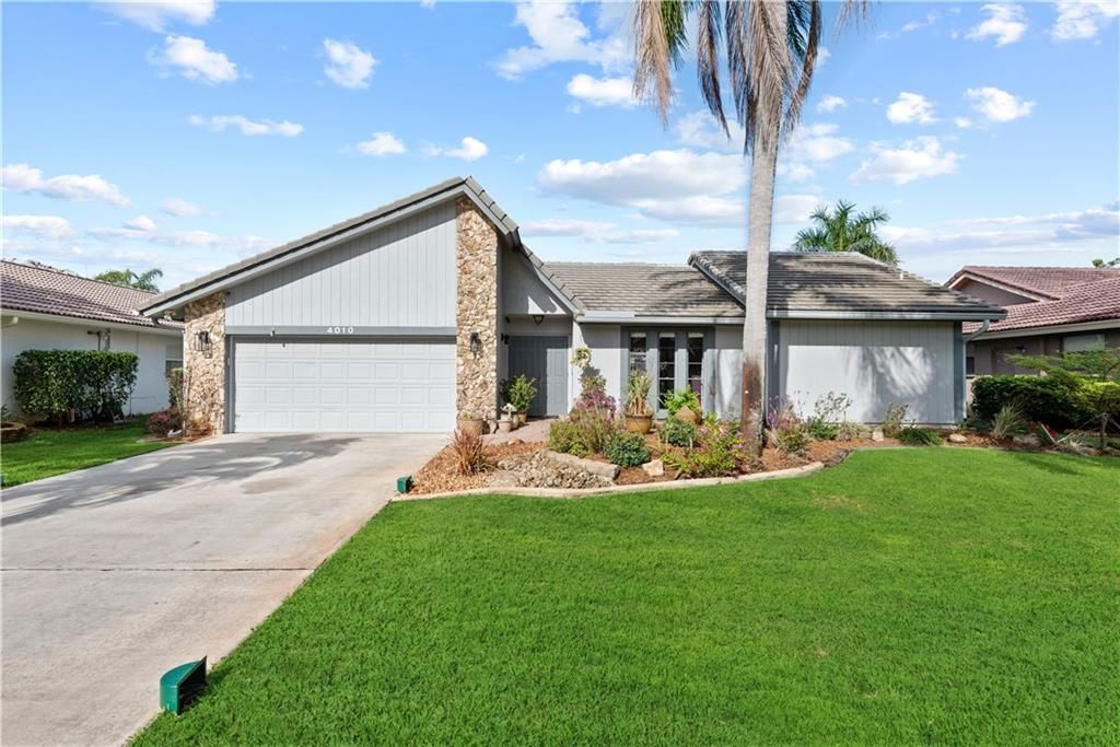 Photo of 4010 NW 72nd Ave, Coral Springs, FL 33065 (MLS # F10321856)